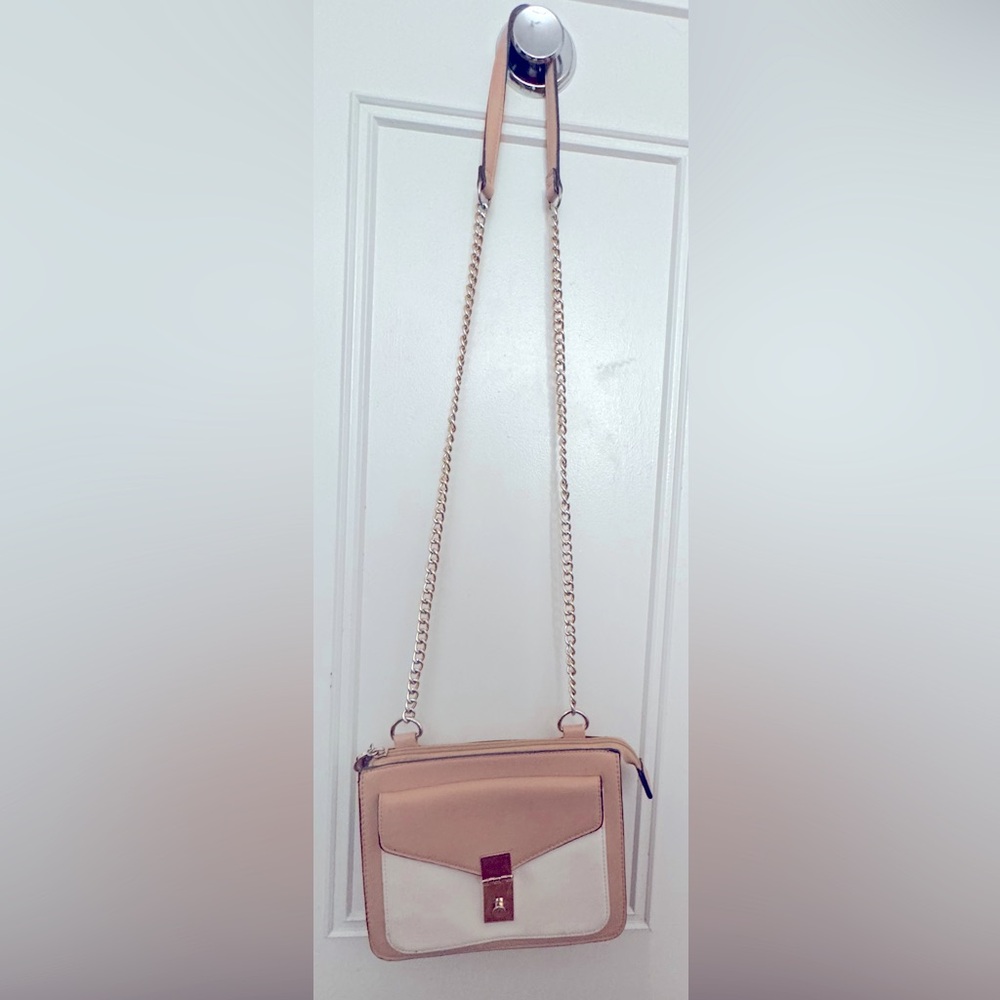 Cream and white nyc expressions crossbody